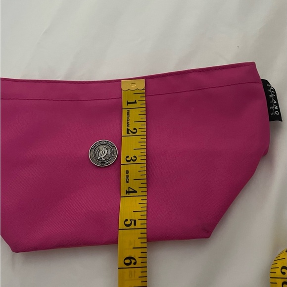 Milano Serise 
•Makeup Bag 
•Change Purse 
•Dark Pink Orange
•Zipper closure - Picture 5 of 6